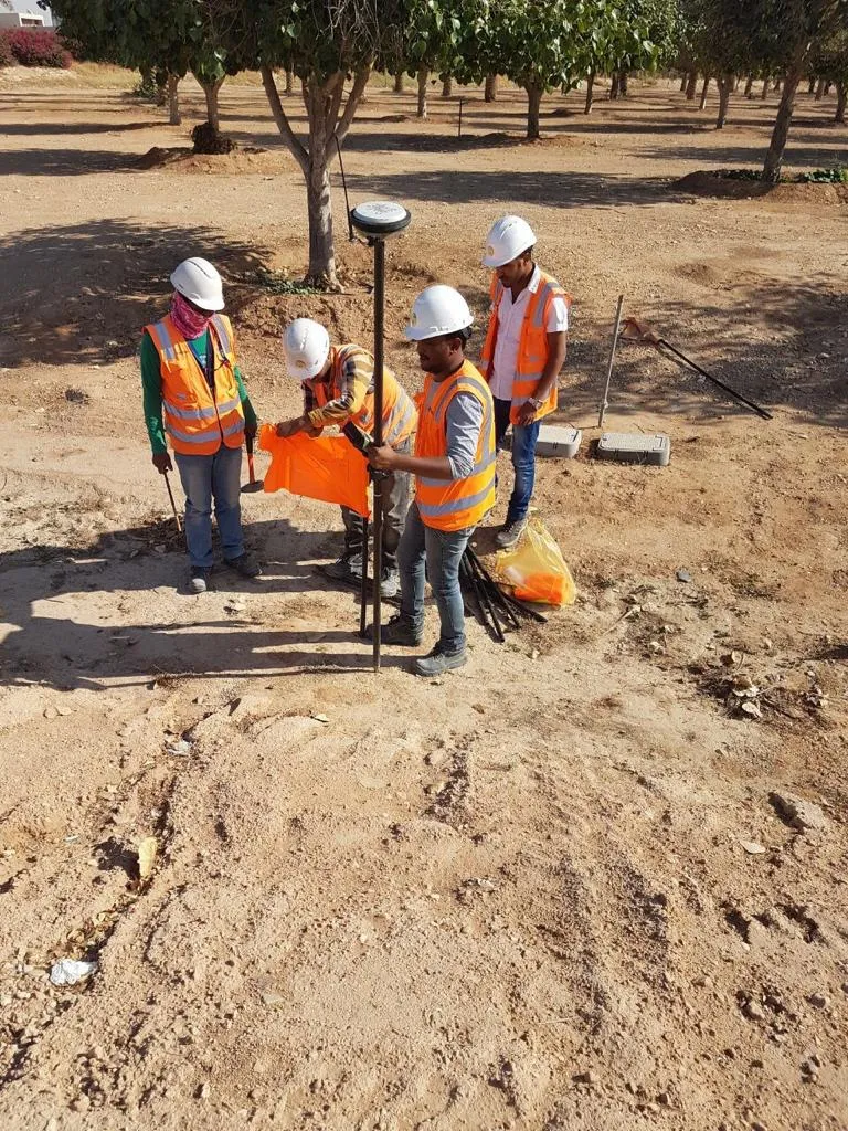 Areen surveyors setting a GNSS control mark on a Riyadh plot