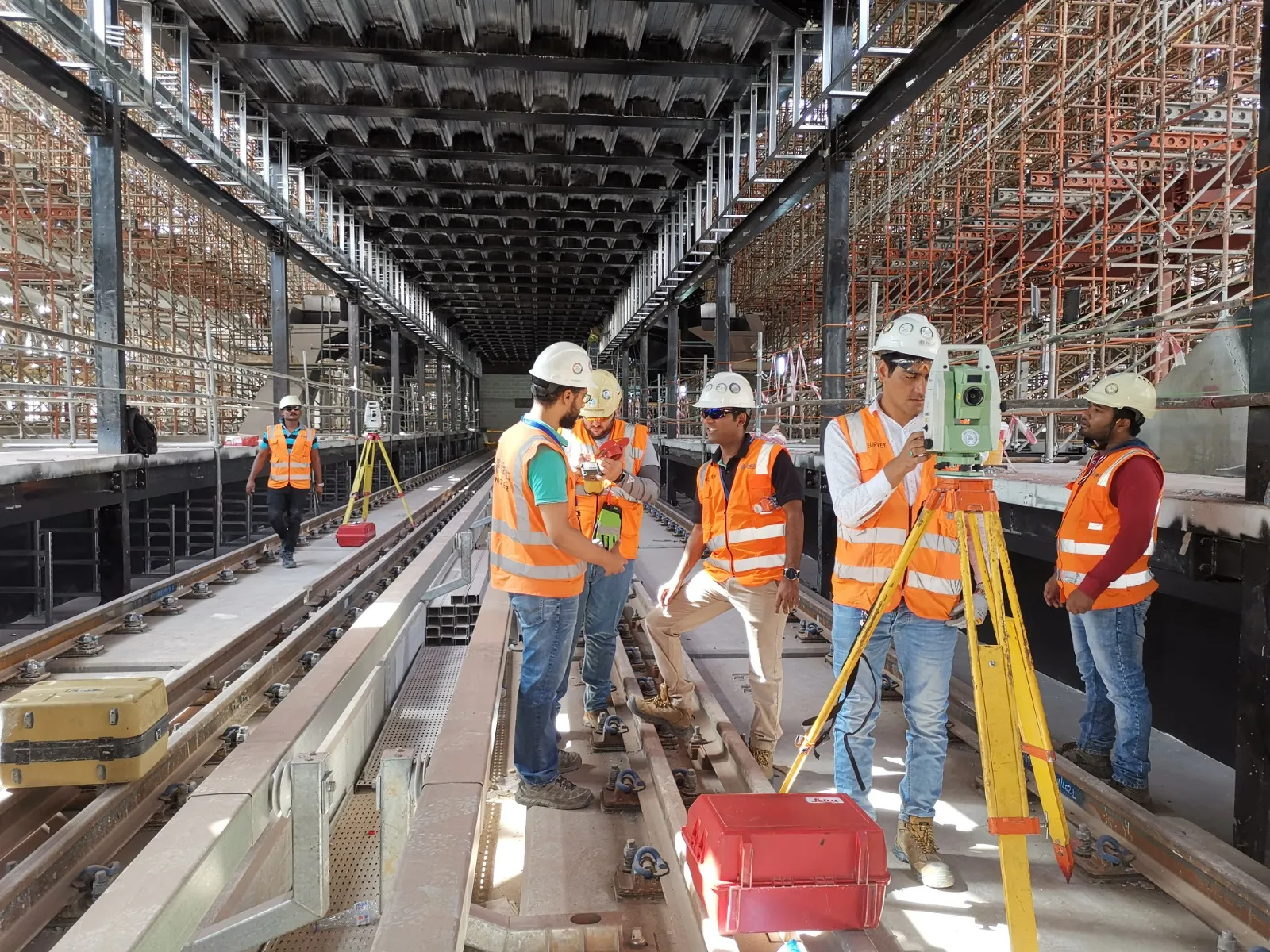 Areen survey crew setting up a total station on a Riyadh Metro track
